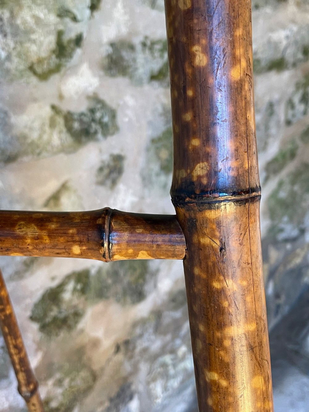 A tall Victorian freestanding easel crafted from mottled brown bamboo with cross-bracing and support pegs. View XXV