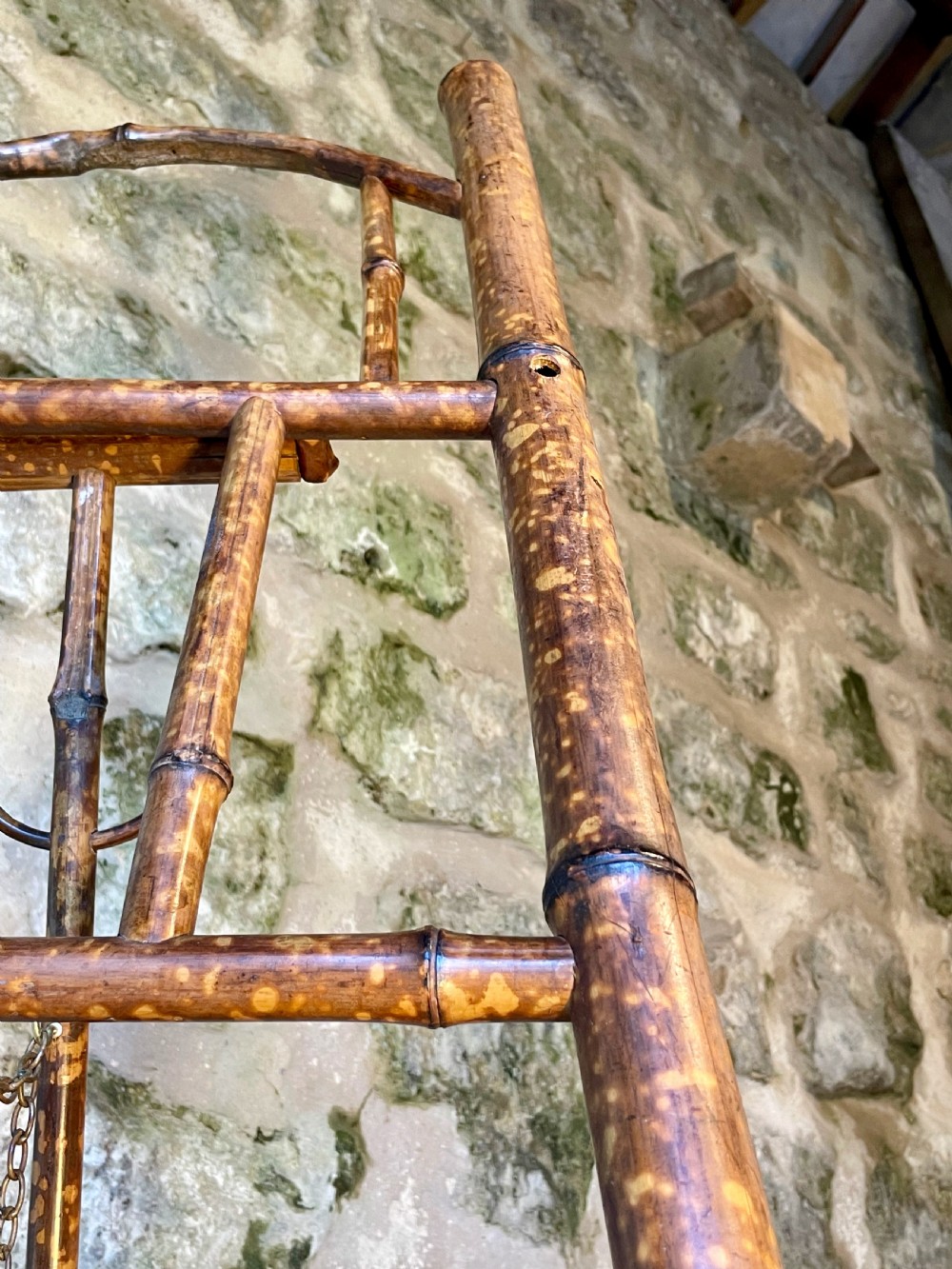 A tall Victorian freestanding easel crafted from mottled brown bamboo with cross-bracing and support pegs. View XXVI