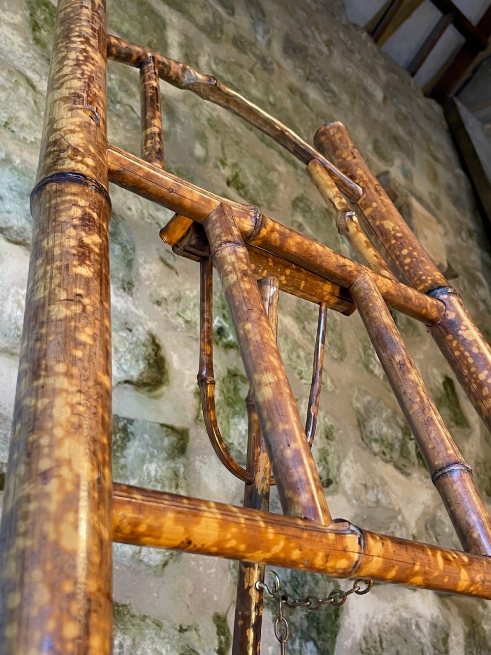 A tall Victorian freestanding easel crafted from mottled brown bamboo with cross-bracing and support pegs. View XXVII