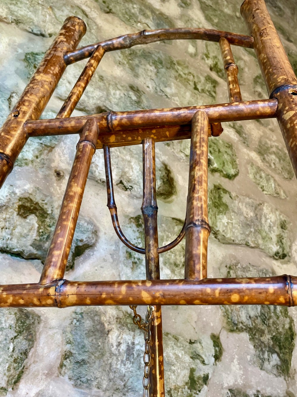 A tall Victorian freestanding easel crafted from mottled brown bamboo with cross-bracing and support pegs. View XXVIII