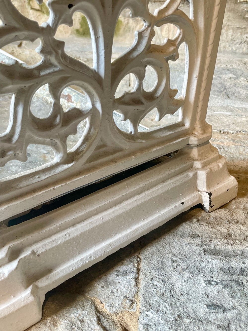 A white painted cast iron stick stand featuring openwork Gothic tracery side panels, a circular grid top section, and a removable double drip tray. View XXII