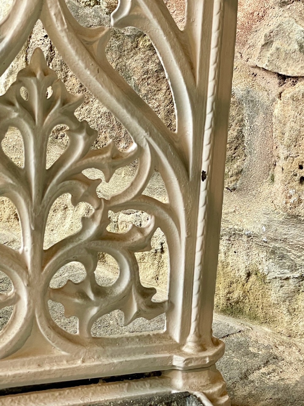A white painted cast iron stick stand featuring openwork Gothic tracery side panels, a circular grid top section, and a removable double drip tray. View XXIII