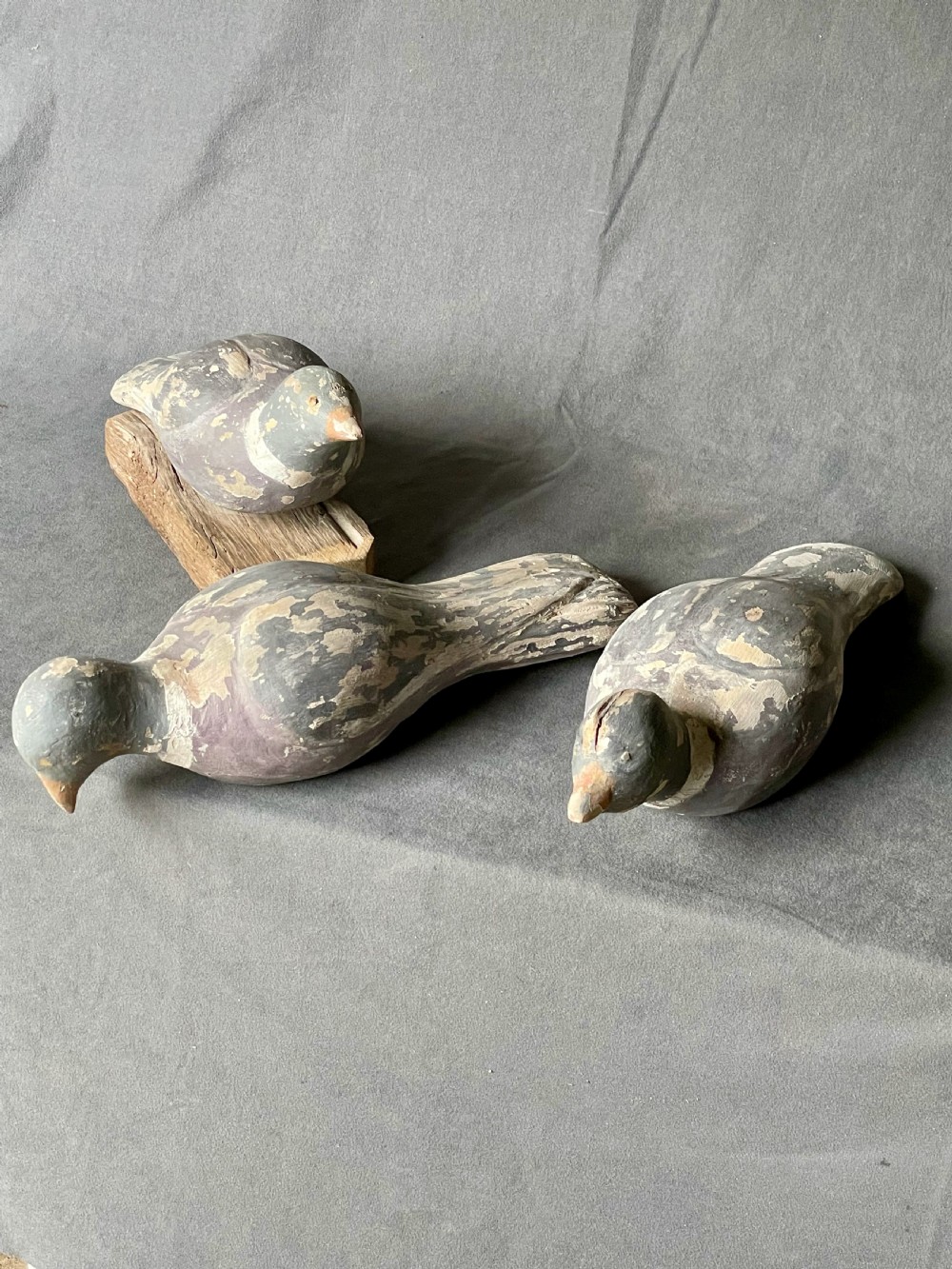Three decoy pigeon figures View III