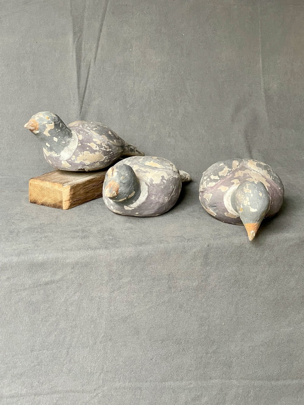 Three decoy pigeon figures View VIII