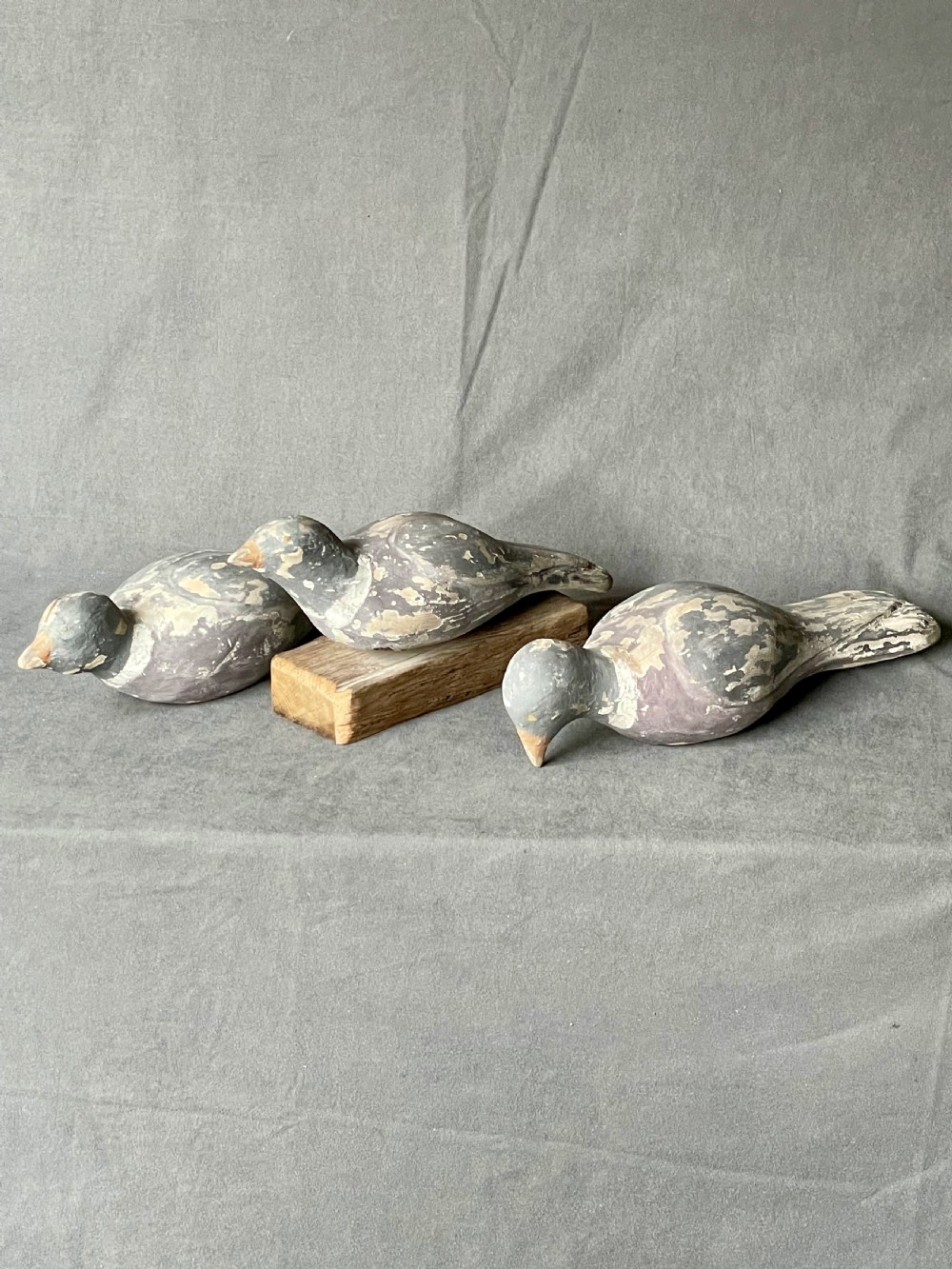Three decoy pigeon figures View XVI