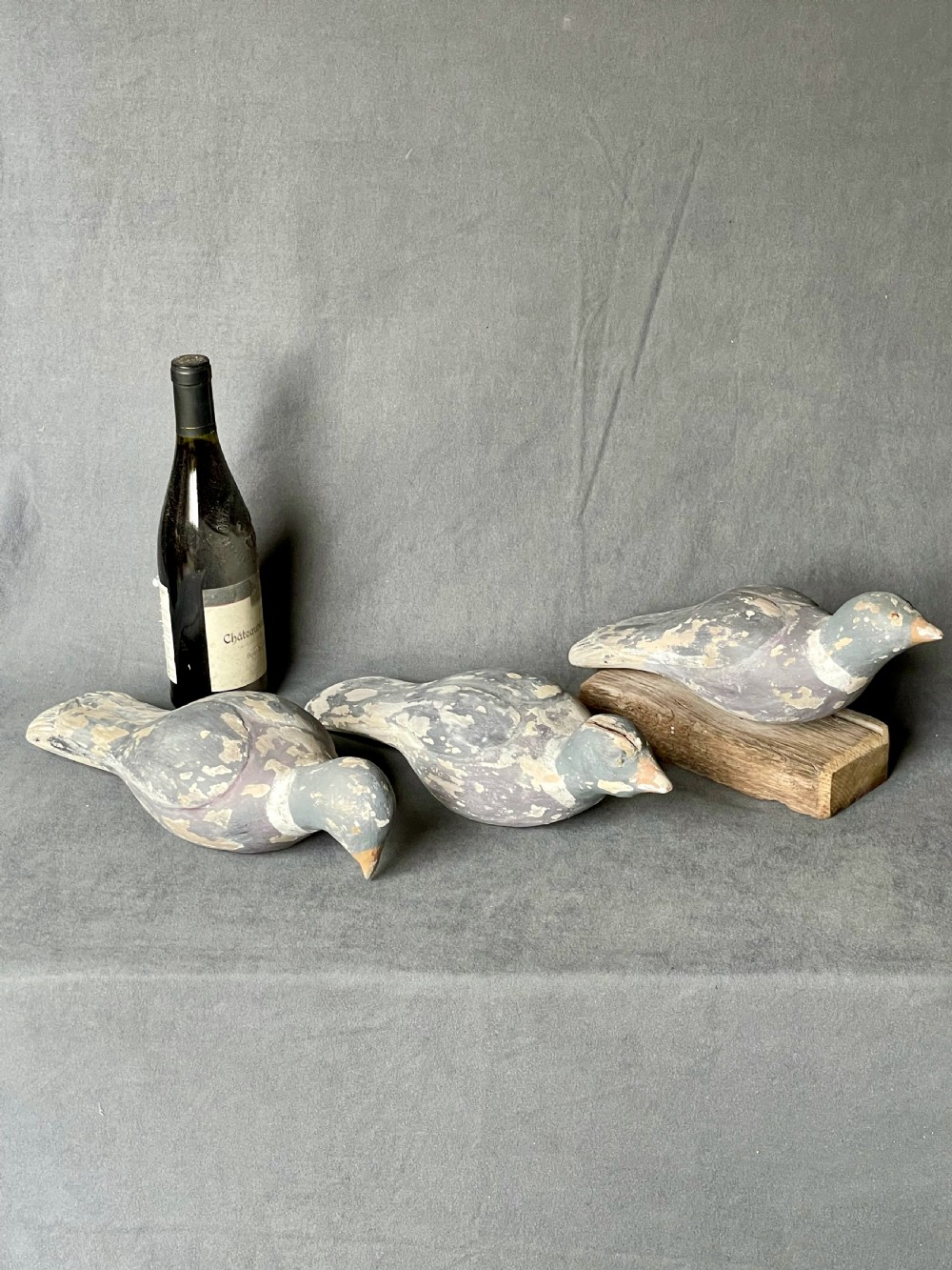 Three decoy pigeon figures View XXI