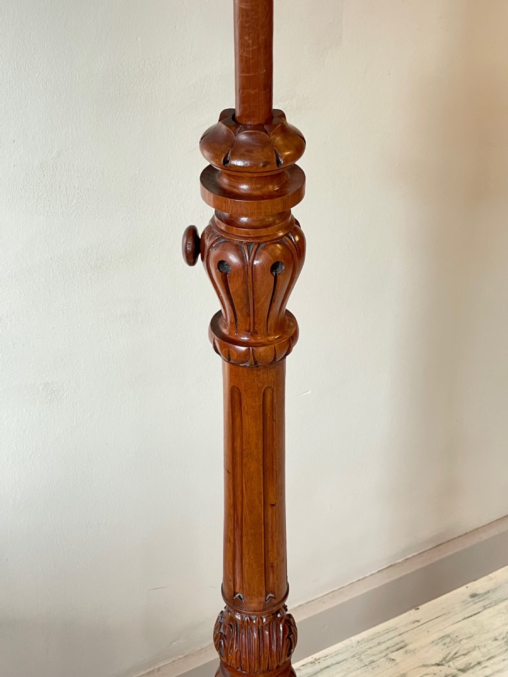 A nineteenth-century mahogany music stand featuring a lyre-shaped rest, a carved turned stem, and a triform base terminating in paw feet. View IV