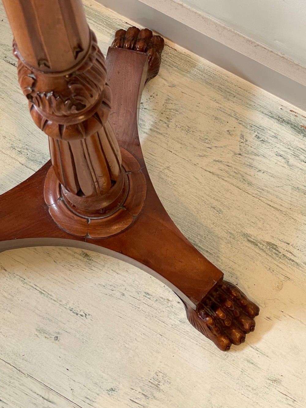 A nineteenth-century mahogany music stand featuring a lyre-shaped rest, a carved turned stem, and a triform base terminating in paw feet. View XI