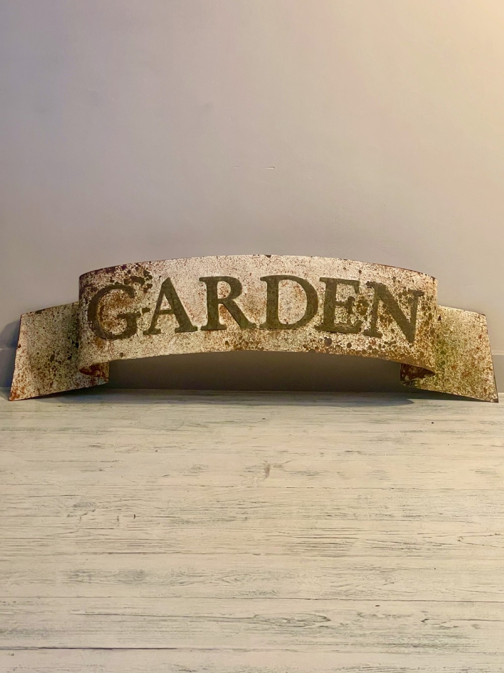 Painted wall-hanging sign