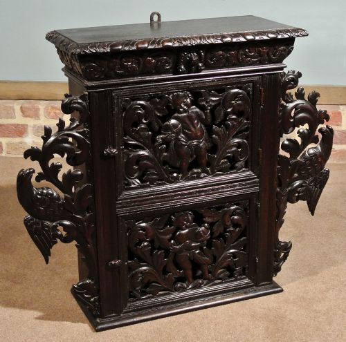 Early 17th Century Oak Livery Cupboard Carved with Cherubim