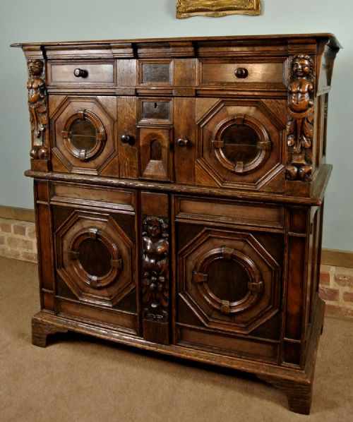 Monumental Early Oak, Elm and Walnut Chest with Figural Carvings