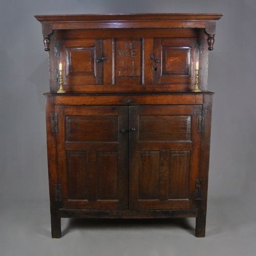 ENGLISH OAK DATED PRESS CUPBOARD WITH SECRET DRAWERS