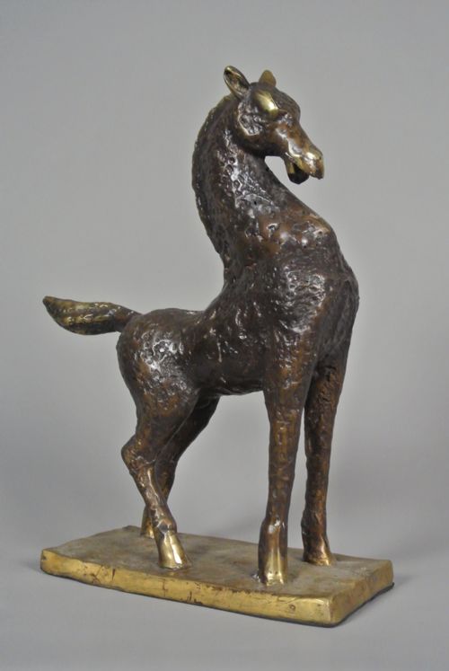 fig 1. An early 20th-century textured bronze sculpture of a stylized standing horse on an integral rectangular base.