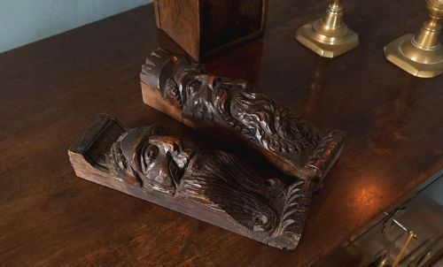 17TH CENTURY CARVED OAK FACE CORBELS C 1670