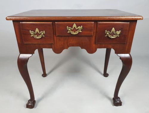 GEORGE III RED WALNUT LOWBOY ON BALL AND CLAW FEET C 1775