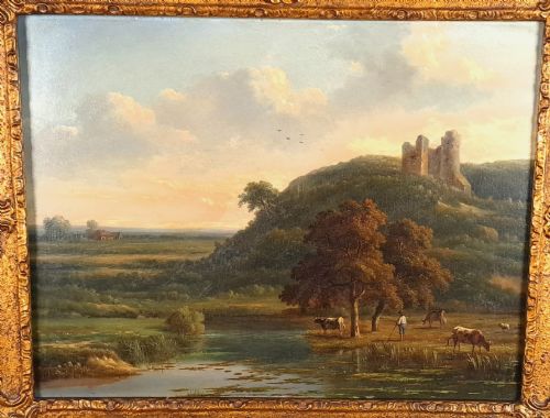 fig 1. An early 19th-century English oil on board landscape painting depicting a pastoral river scene with cattle and castle ruins, housed within an ornate gold giltwood frame.