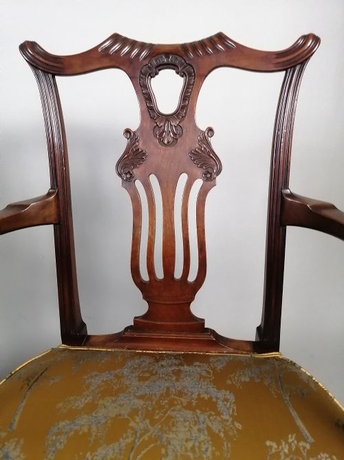 fig 3. A pair of late Victorian mahogany elbow chairs featuring carved lyre back splats, curved arms, cabriole legs, and gold patterned upholstered seats.