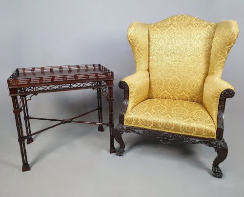 fig 1. A dark padauk Chippendale style silver table featuring a pierced gallery rim, fretwork frieze, cluster legs, and turned stretchers.