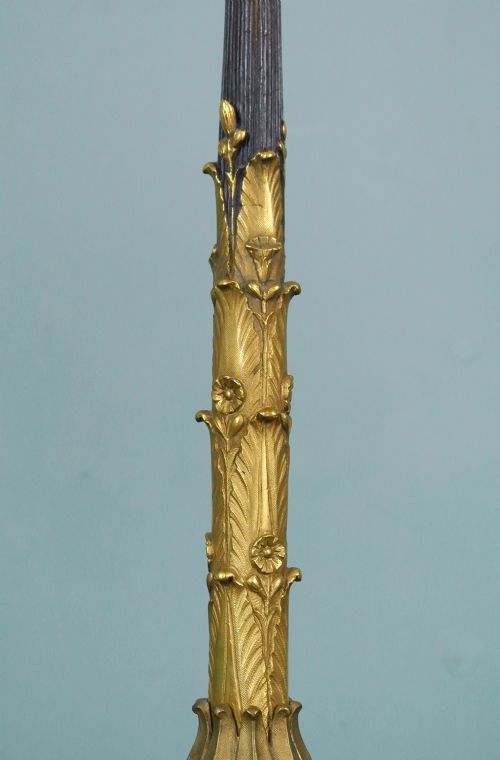 A pair of late nineteenth-century French ormolu and patinated bronze multi-light candelabra topped with crane figures and hung with small gilt chains. View X