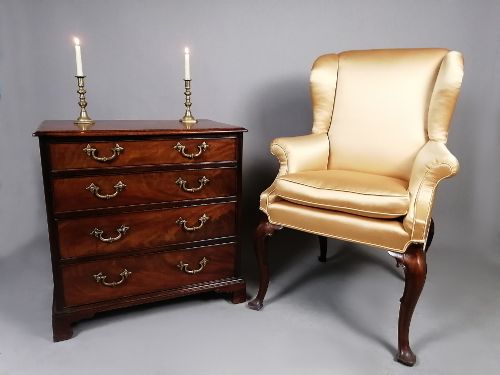 fig 2. A compact George III Cuban mahogany chest of drawers featuring four graduated drawers with brass swan-neck handles and bracket feet.