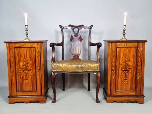 fig 1. A matching pair of late 19th-century rosewood bedside cabinets featuring detailed floral marquetry inlays on the central door panels.