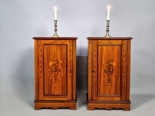 fig 2. A matching pair of late 19th-century rosewood bedside cabinets featuring detailed floral marquetry inlays on the central door panels.