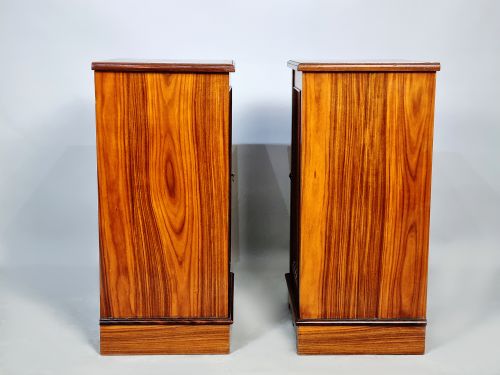 fig 3. A pair of late Victorian rosewood bedside cupboards featuring delicate floral marquetry urn inlays on single panelled doors.