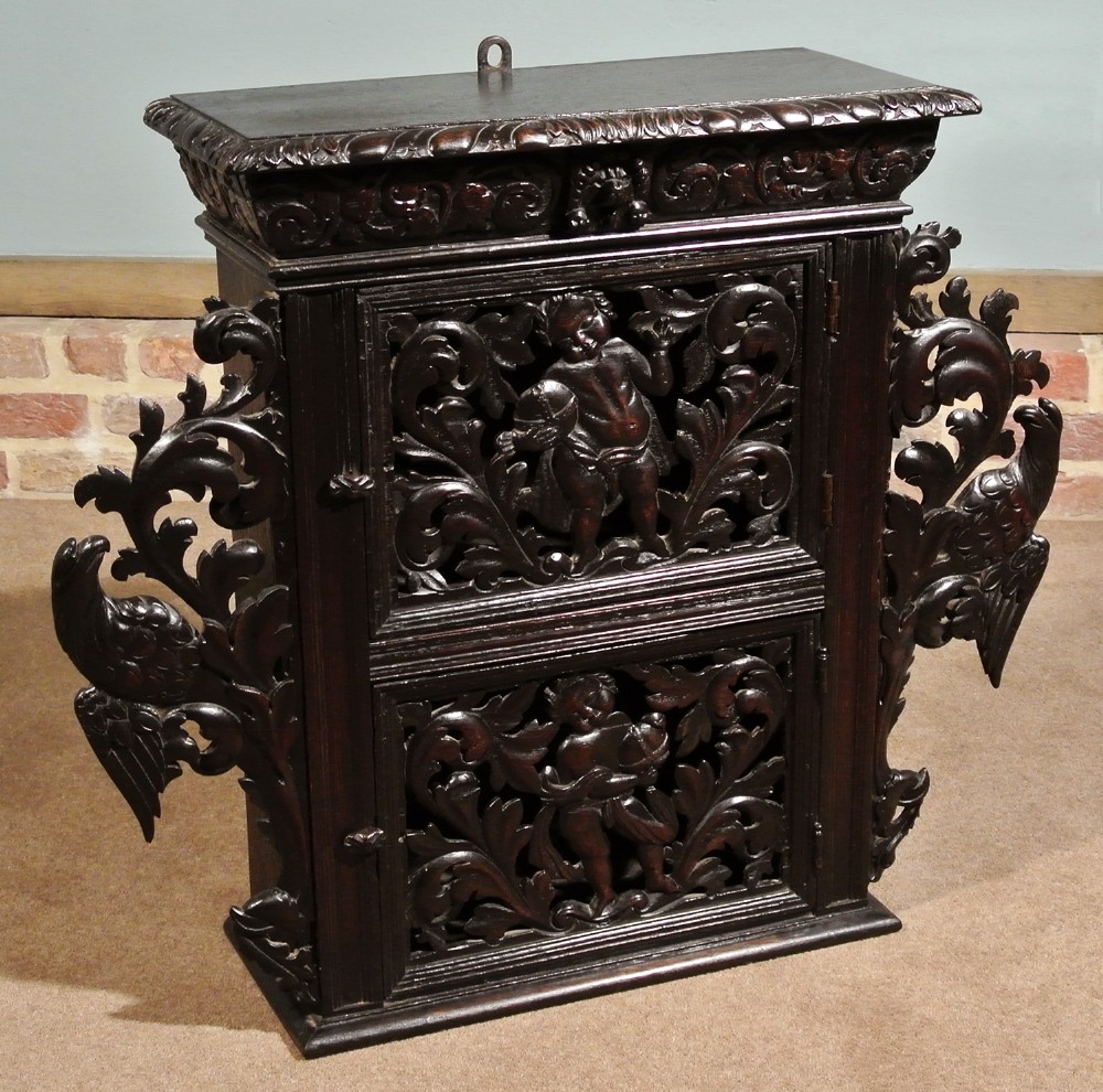 Early 17th Century Oak Livery Cupboard Carved with Cherubim