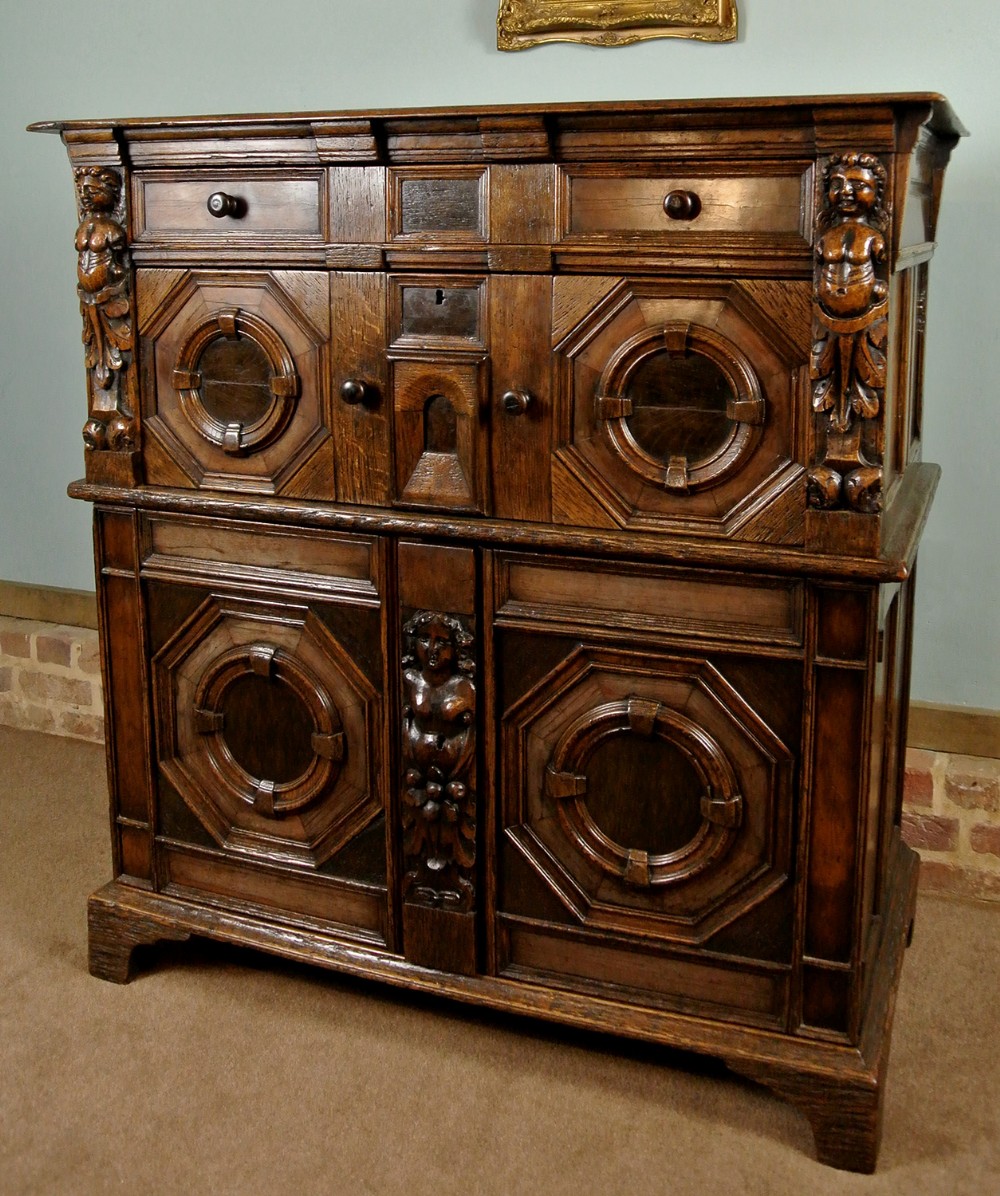 Monumental Early Oak, Elm and Walnut Chest with Figural Carvings 