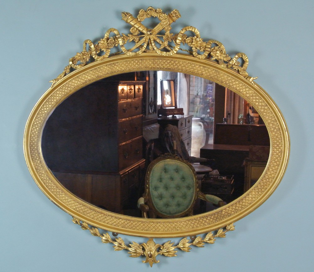 Large and Fine Quality Early 19th Century Oval Giltwood Mirror with Original Plate 