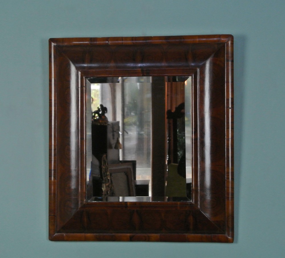 William and Mary Walnut Oyster Veneer Cushion Framed Mirror c. 1690