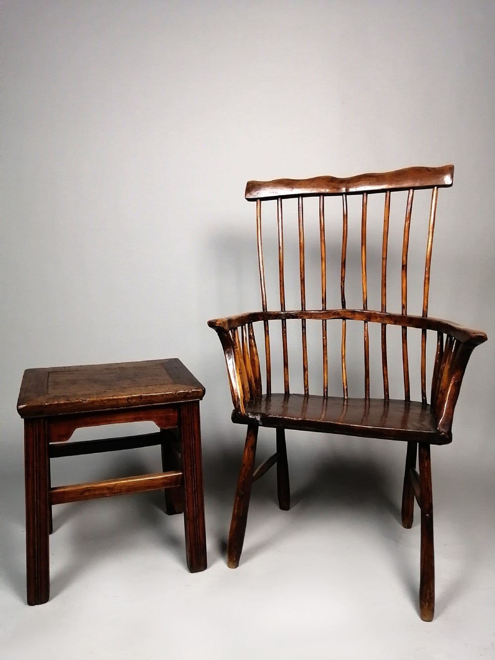 An 18th-century Chinese elm side table featuring a rectangular framed top, shaped apron spandrels, fluted legs, and double stretchers. View II