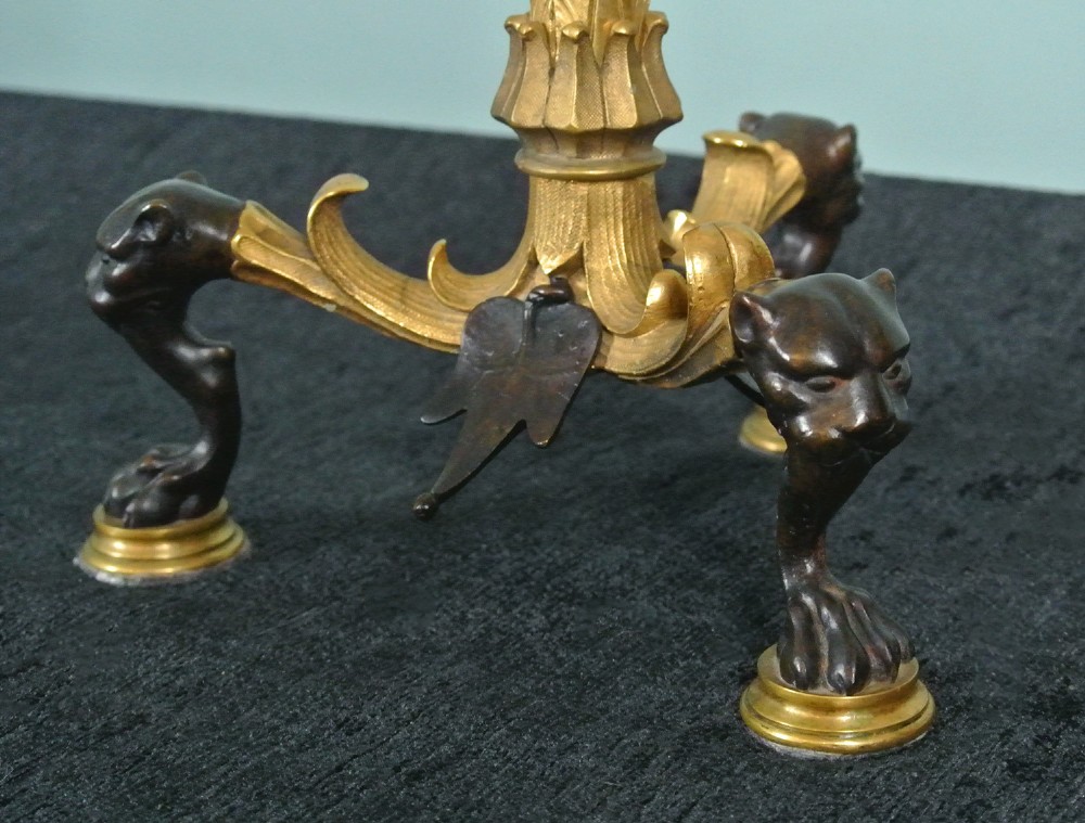 A pair of late nineteenth-century French ormolu and patinated bronze multi-light candelabra topped with crane figures and hung with small gilt chains. View VI