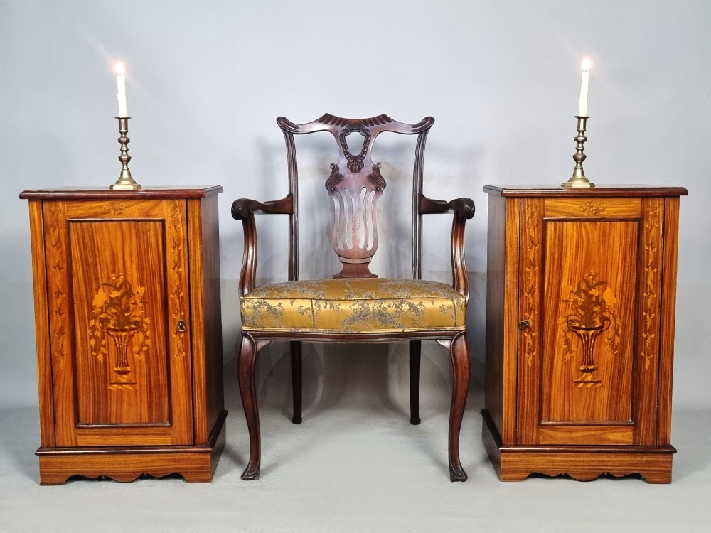 A matching pair of late 19th-century rosewood bedside cabinets featuring detailed floral marquetry inlays on the central door panels. View II