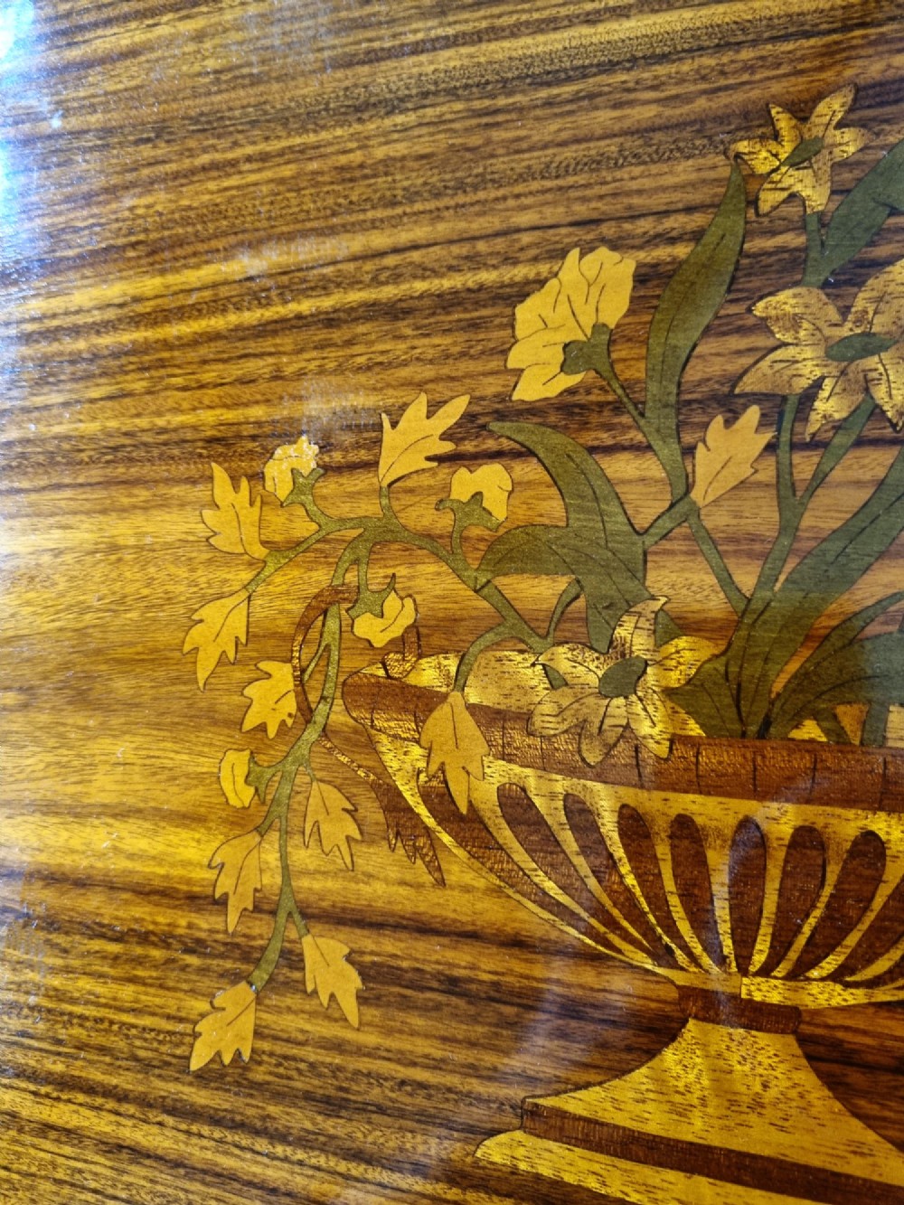 A matching pair of late 19th-century rosewood bedside cabinets featuring detailed floral marquetry inlays on the central door panels. View VI