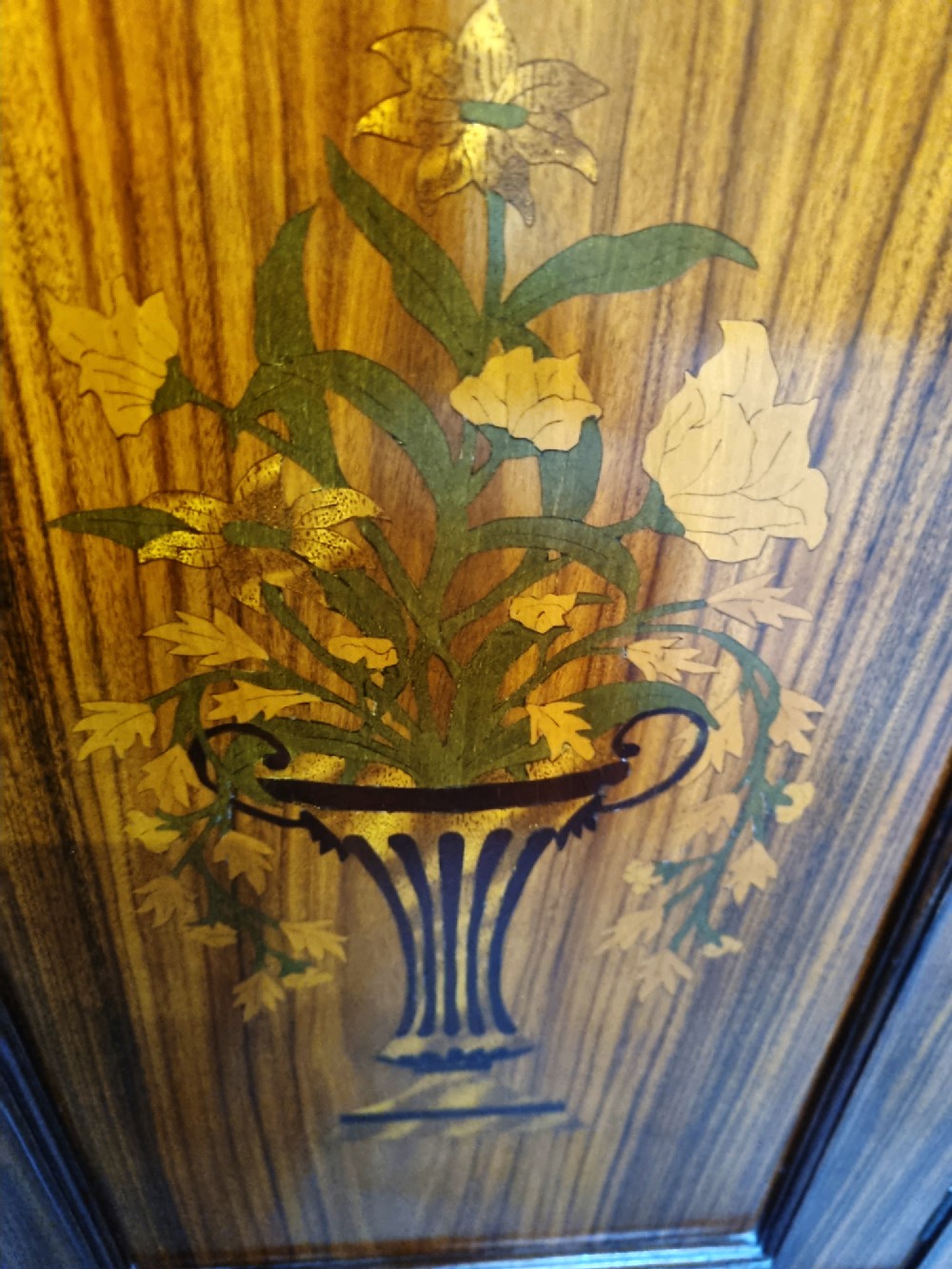 A matching pair of late 19th-century rosewood bedside cabinets featuring detailed floral marquetry inlays on the central door panels. View VII
