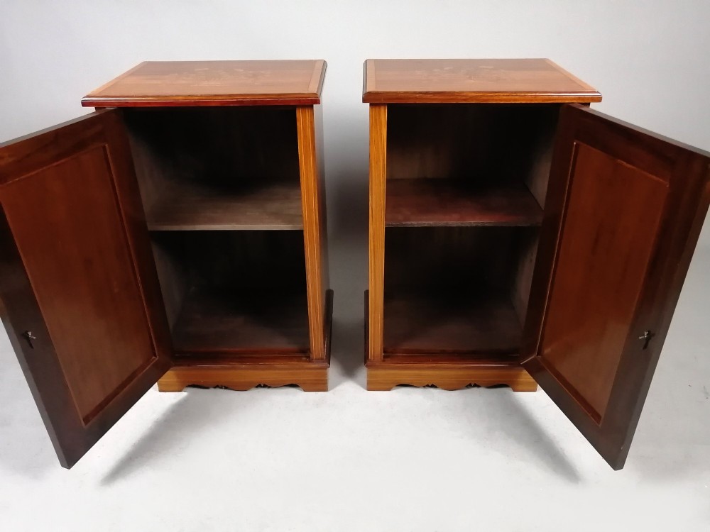 A matching pair of late 19th-century rosewood bedside cabinets featuring detailed floral marquetry inlays on the central door panels. View XI