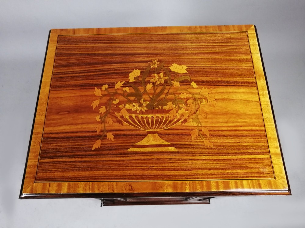 A matching pair of late 19th-century rosewood bedside cabinets featuring detailed floral marquetry inlays on the central door panels. View XII