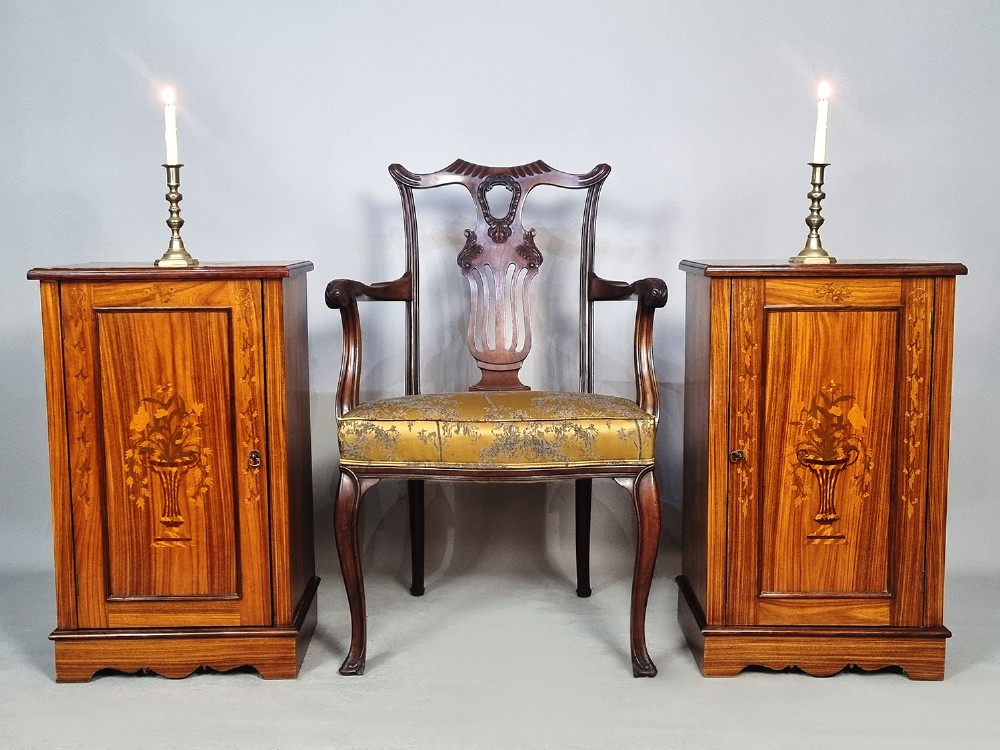 A pair of late Victorian rosewood bedside cupboards featuring central floral urn marquetry inlays on single-panel doors and plinth bases. View II