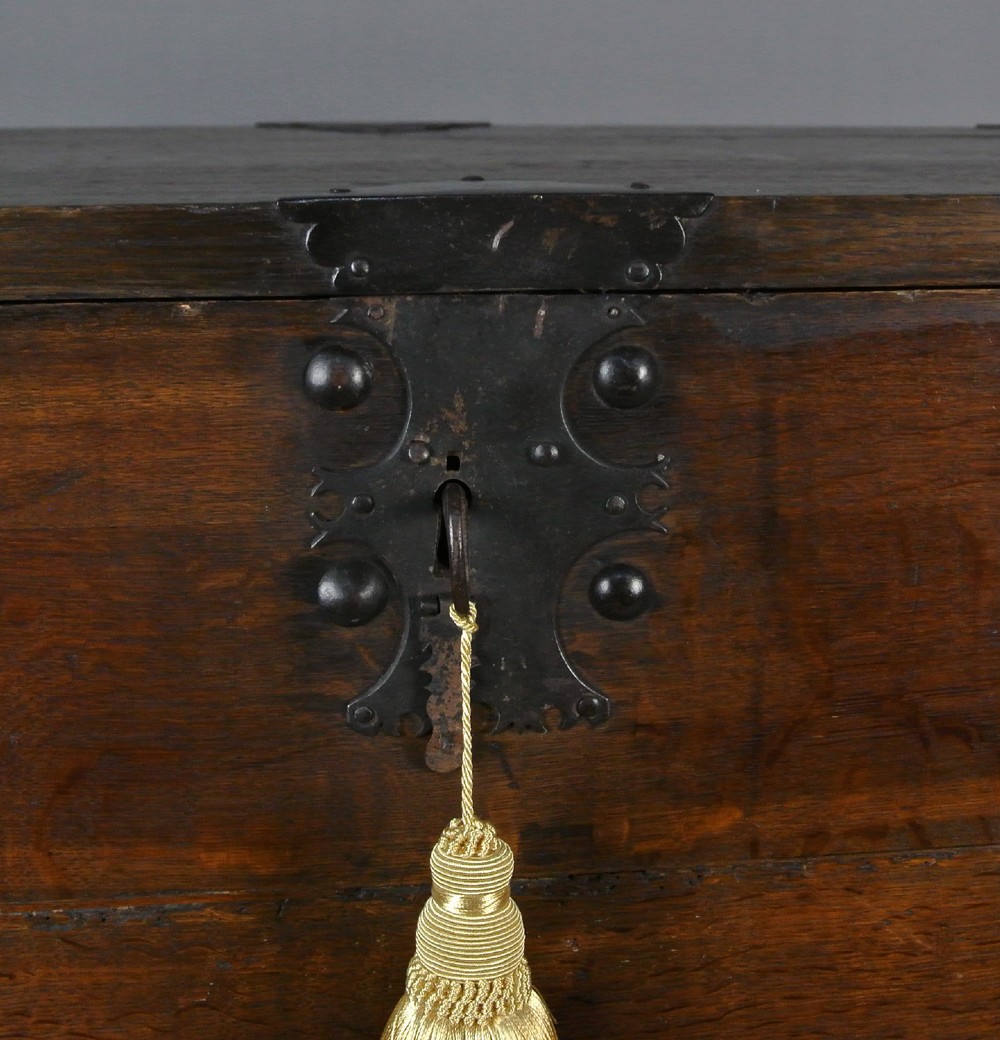 A seventeenth-century dark oak fall-front writing desk on a turned leg stand with interior drawers and wrought iron corner brackets. View IV