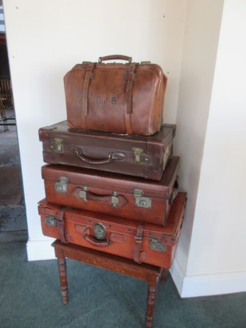 fig 1. Stack of three leather suit cases & a large size Gladstone bag, all the suitcases are c1900. 