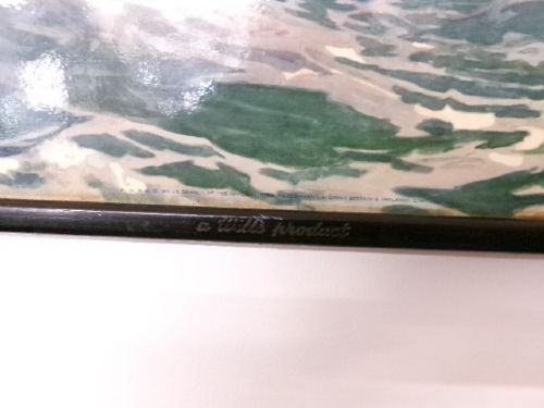 A framed vintage cardboard advertisement for Capstan cigarettes featuring a steam vessel navigating rough seas under text reading Have a Capstan. View IX