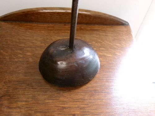 An 18th-century hand-forged wrought iron rushlight holder with an integrated candle socket, mounted on a turned dome fruitwood base. View VI
