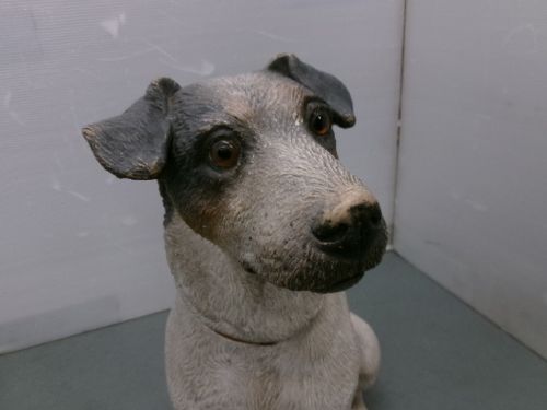 A Victorian painted terracotta figure depicting a seated Jack Russell terrier with grey ears and a brown painted collar. View II