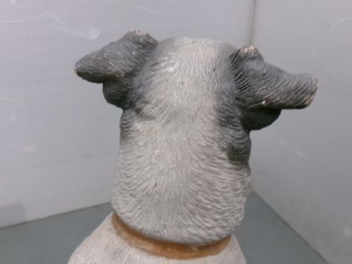 A Victorian painted terracotta figure depicting a seated Jack Russell terrier with grey ears and a brown painted collar. View VIII
