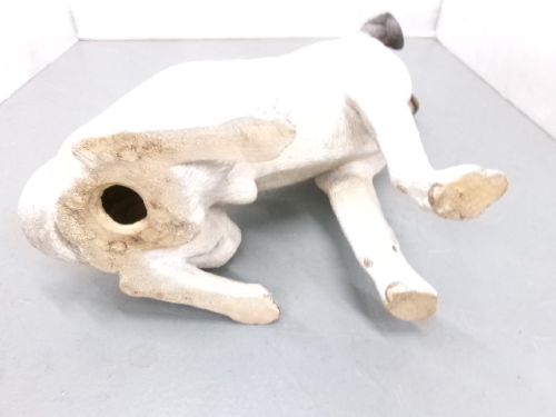 A Victorian painted terracotta figure depicting a seated Jack Russell terrier with grey ears and a brown painted collar. View IX