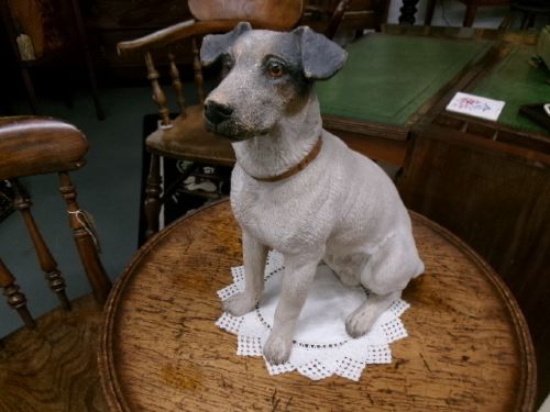 A Victorian painted terracotta figure depicting a seated Jack Russell terrier with grey ears and a brown painted collar. View XI