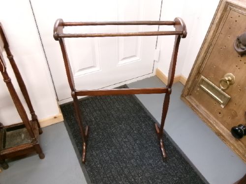 A Victorian mahogany freestanding towel rail featuring double turned crossbars, shaped vertical uprights with scrolled top handles, and splayed feet. View II