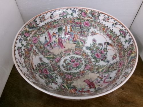A large round Chinese Canton porcelain punch bowl decorated with hand-painted polychrome enamel panels depicting figures, flowers, and birds. View V