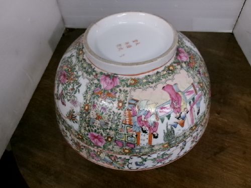 A large round Chinese Canton porcelain punch bowl decorated with hand-painted polychrome enamel panels depicting figures, flowers, and birds. View IX